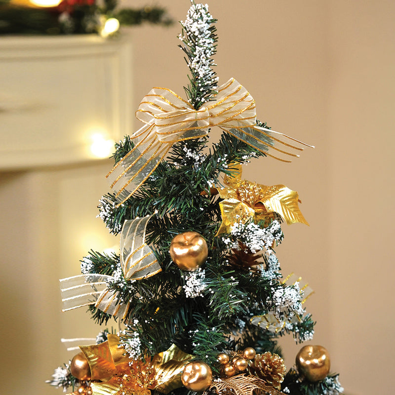 Decorated Christmas tree with finishing touches