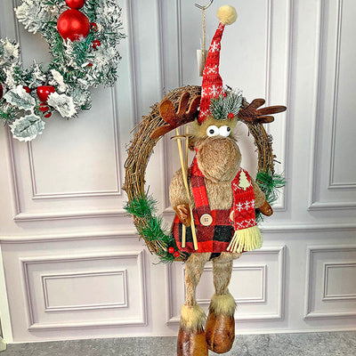 Fluffy Rudolf reindeer Christmas wreath in knitted winter clothes