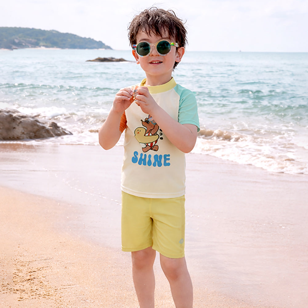 2 Pcs T-Shirt & Shorts Set Ivory, Teal & Yellow "Shine" Cartoon Print UPF 50+ Kids Swimwear with Matching Swim Cap With Free Wash Bag